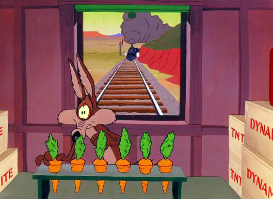 wile e. coyote about to be run over by a train